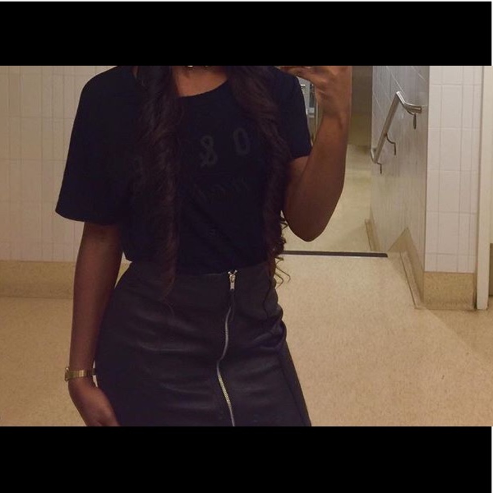 Black leather skirt with zipper on the front.